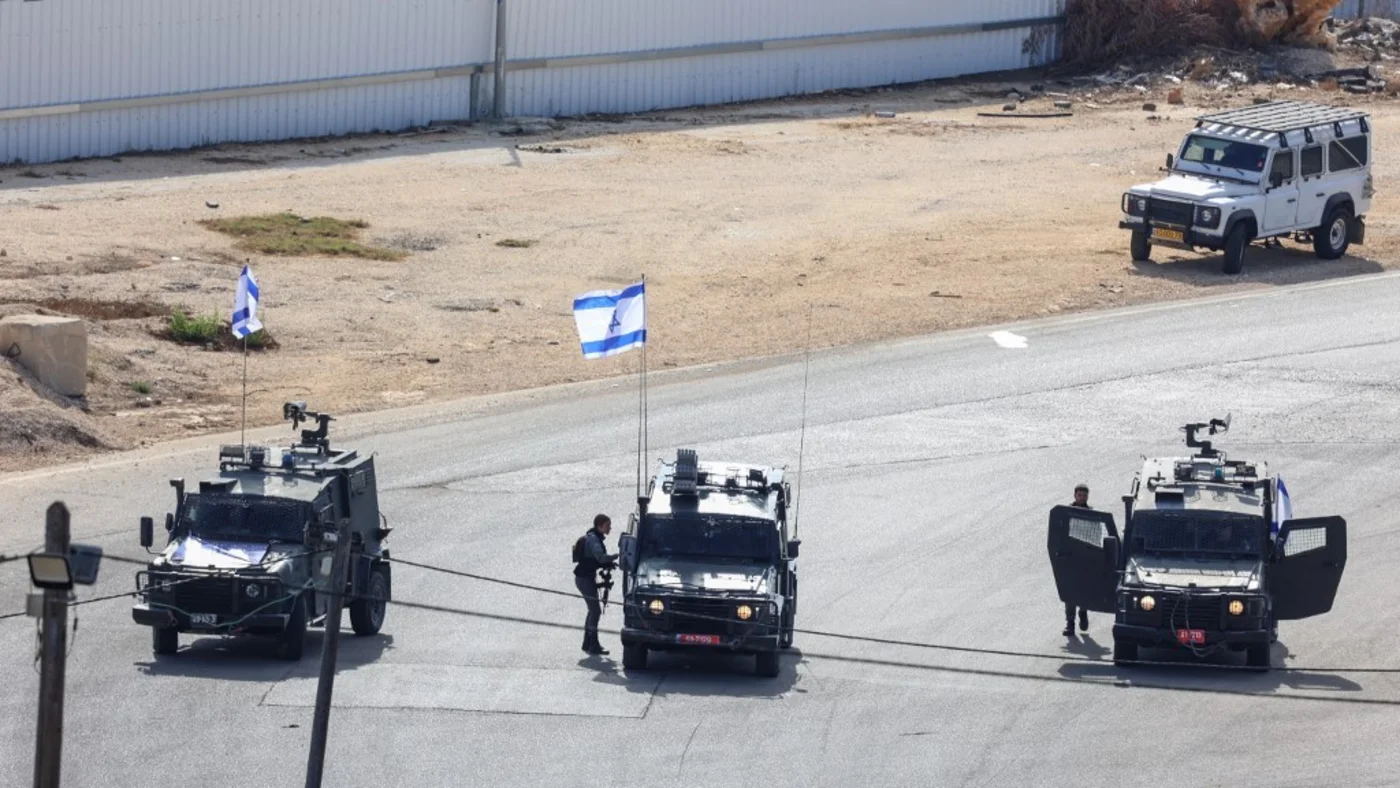Israeli forces stand guard at the Ofer military prison located between Ramallah and Beitunia in the occupied West Bank on 13 October 2025 (AFP)