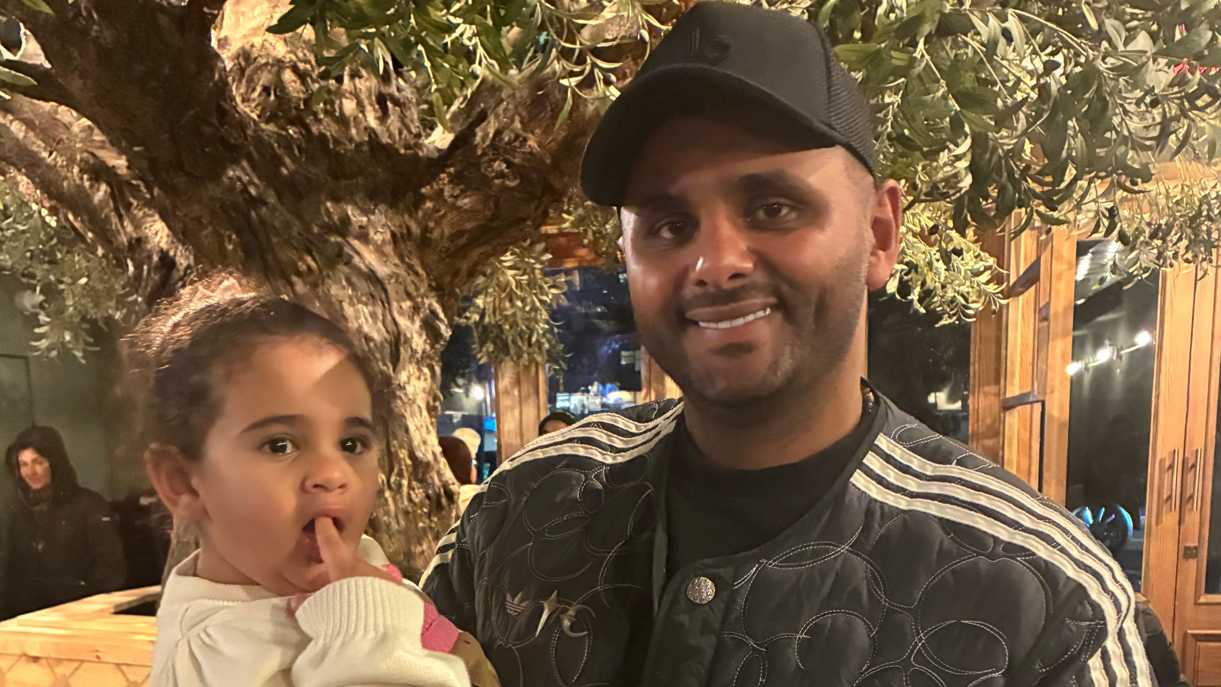 Abdul Elenani with his daughter at the Astoria location of Ayat restaurant in Queens, New York 2025