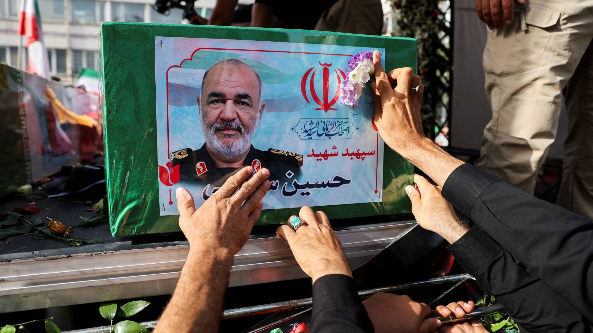 People attend the funeral procession of Iranian military commanders and nuclear scientists killed in Israeli strikes, in Tehran, Iran