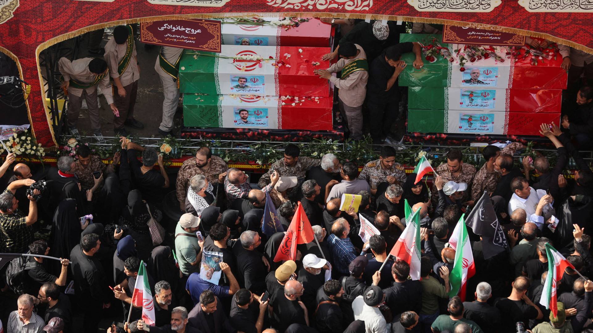 People touch the coffins as they believe touching them is a sign of blessing (Reuters)