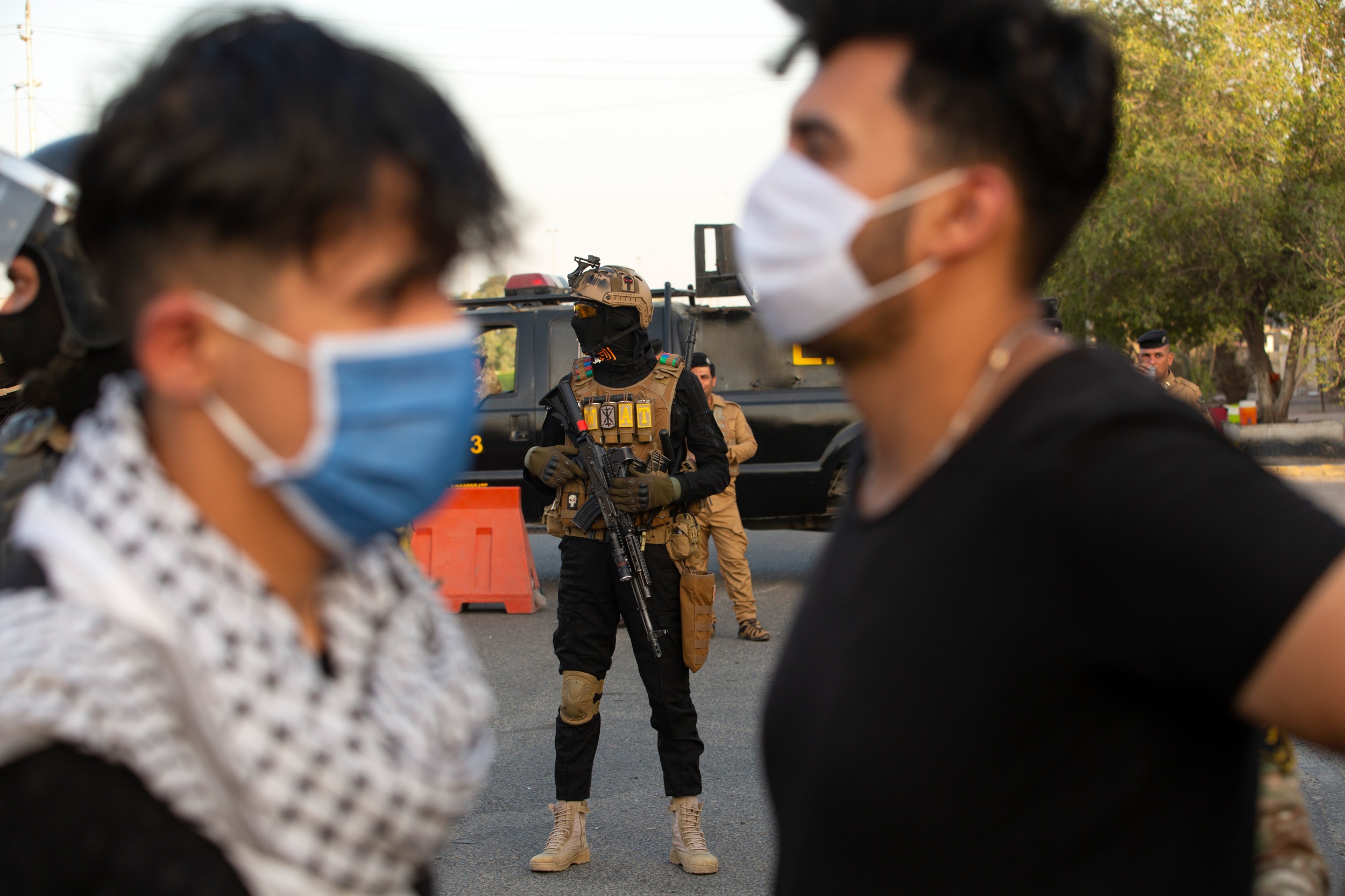 Mask-clad anti-government protesters take part in a demonstration in the southern Iraqi city of Basra despite the ongoing threat of the novel coronavirus, on 3 June 2020 (AFP)