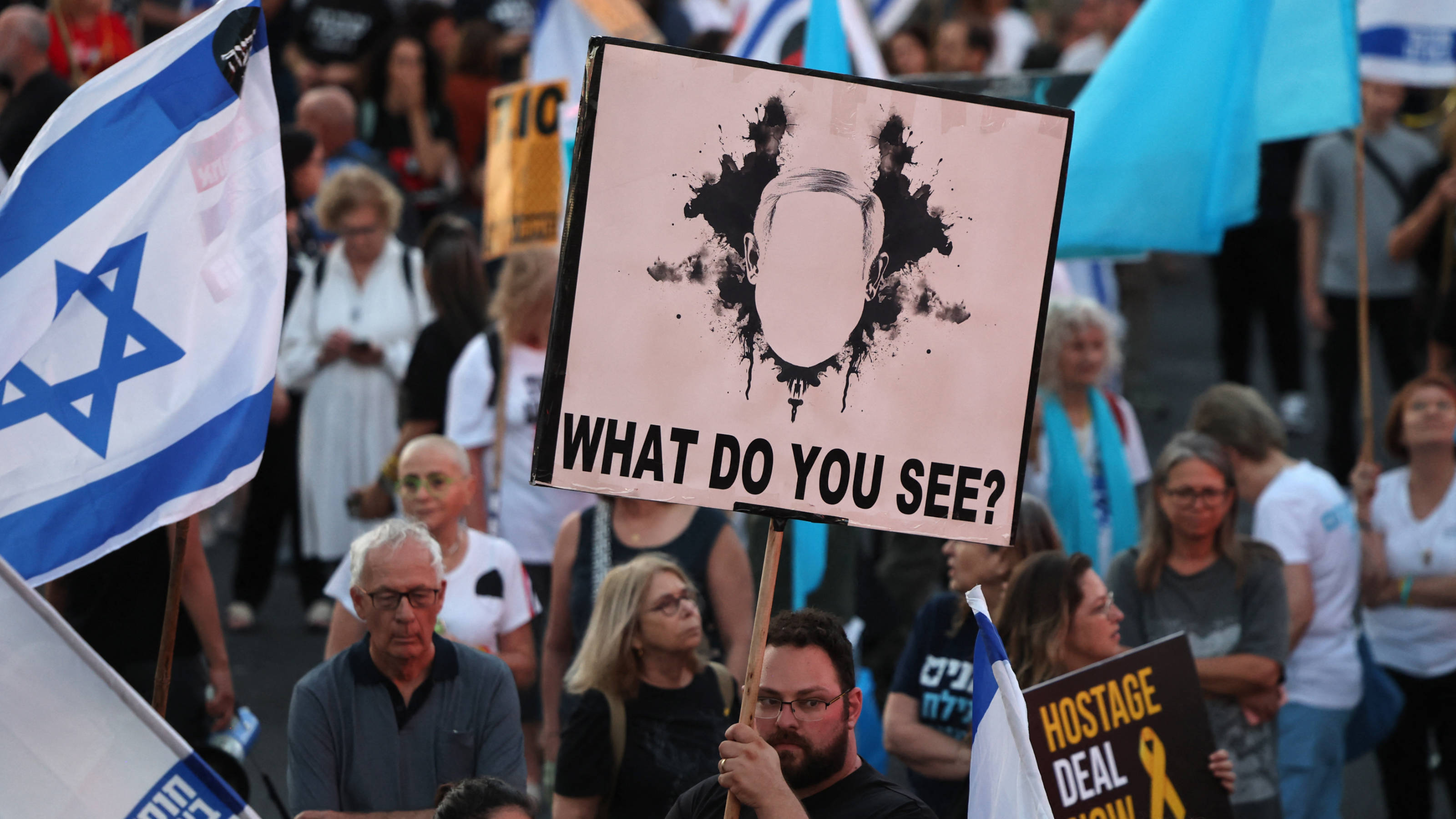 Relatives and supporters of Israelis held hostage by Hamas in Gaza demonstrate to call for their release in Tel Aviv on 1 June 2024 (AFP)