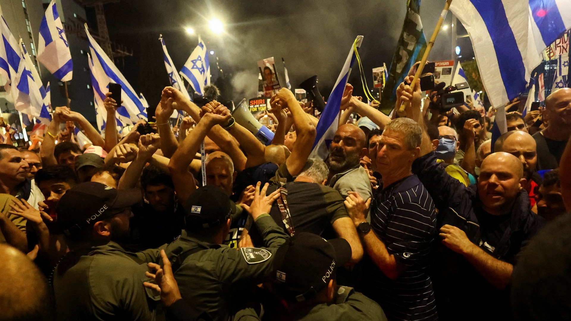 Police officers clash with demonstrators during a protest against Israeli Prime Minister Benjamin Netanyahu's government in Tel Aviv on March 30 (Reuters)