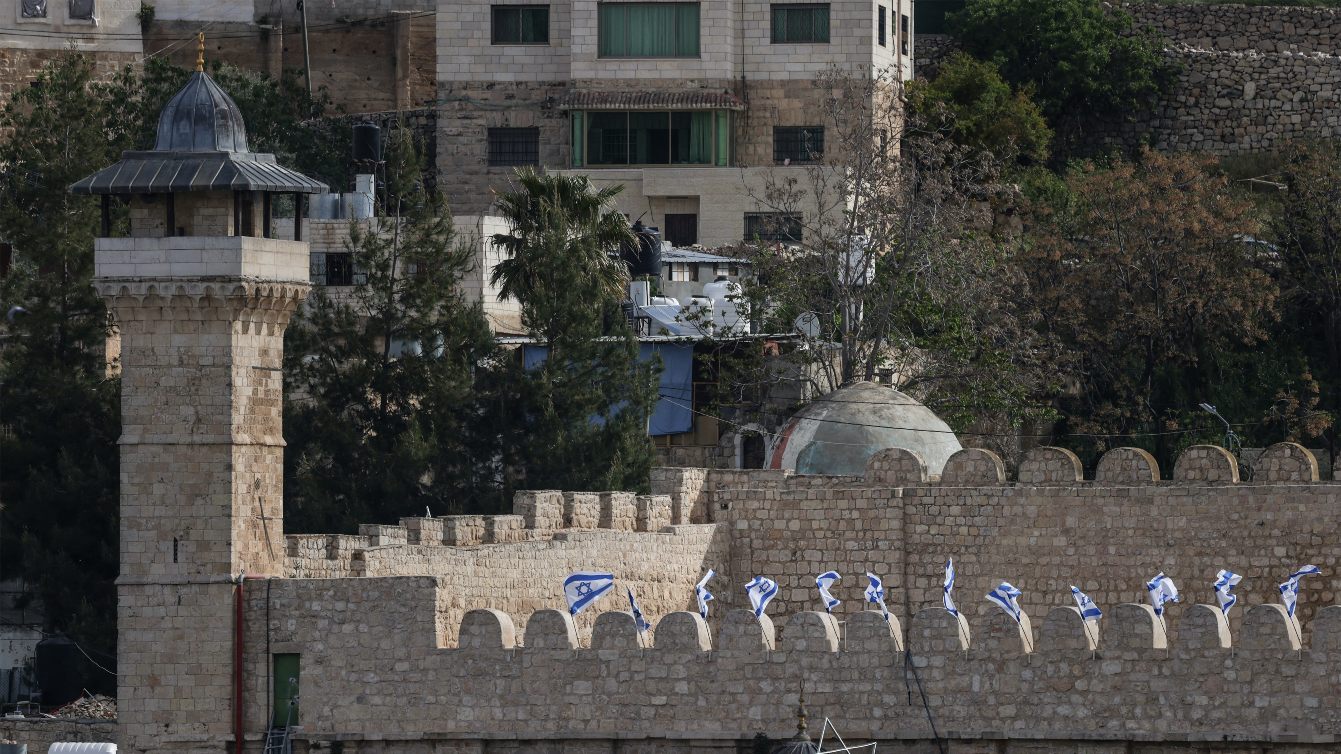 Israeli flags adorn the Ibrahimi Mosque in Hebron as Israel marks Remembrance Day, 21 April 2026 (Hazem Bader/AFP)