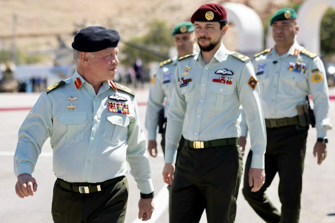Jordan's King Abdullah II (L) and his son Crown Prince Hussein (C) attend a ceremony marking the 57th anniversary of the Battle of al-Karamah in al-Karamah, Jordan, 23 March 2025