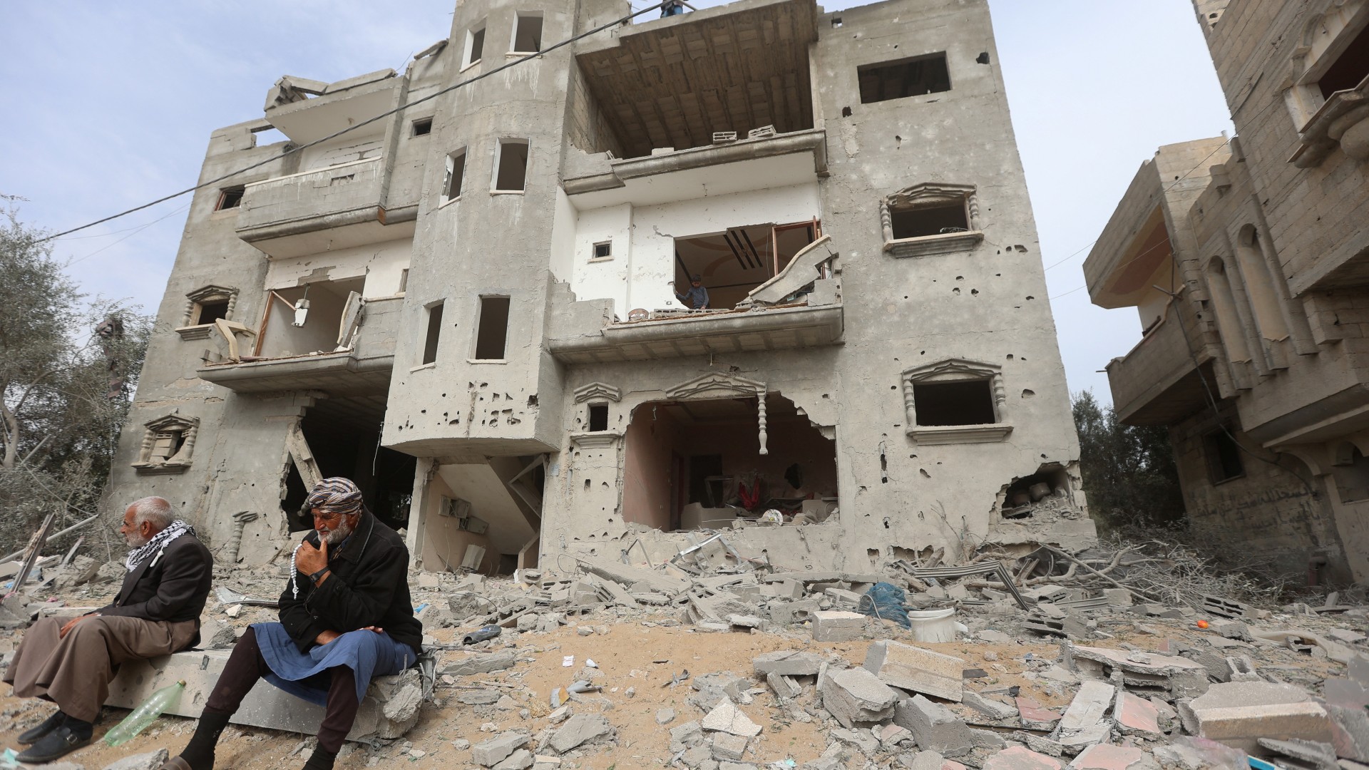 Palestinians gather at the site of an Israeli strike on a house, amid the ongoing conflict between Israel and Hamas, in Khan Younis in the southern Gaza Strip  on 29 March 29 (Reuters)