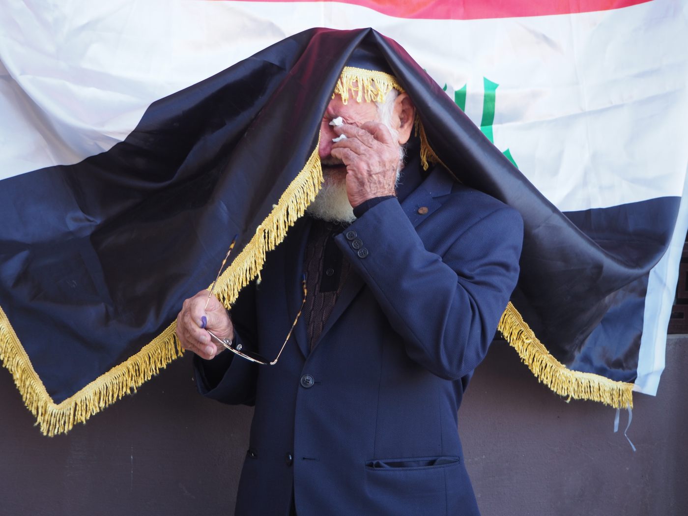 Mohamed Rashat Ahmed, 82, is emotional at a Kirkuk polling station on 10 October 2021 (MEE/Tom Westcott)