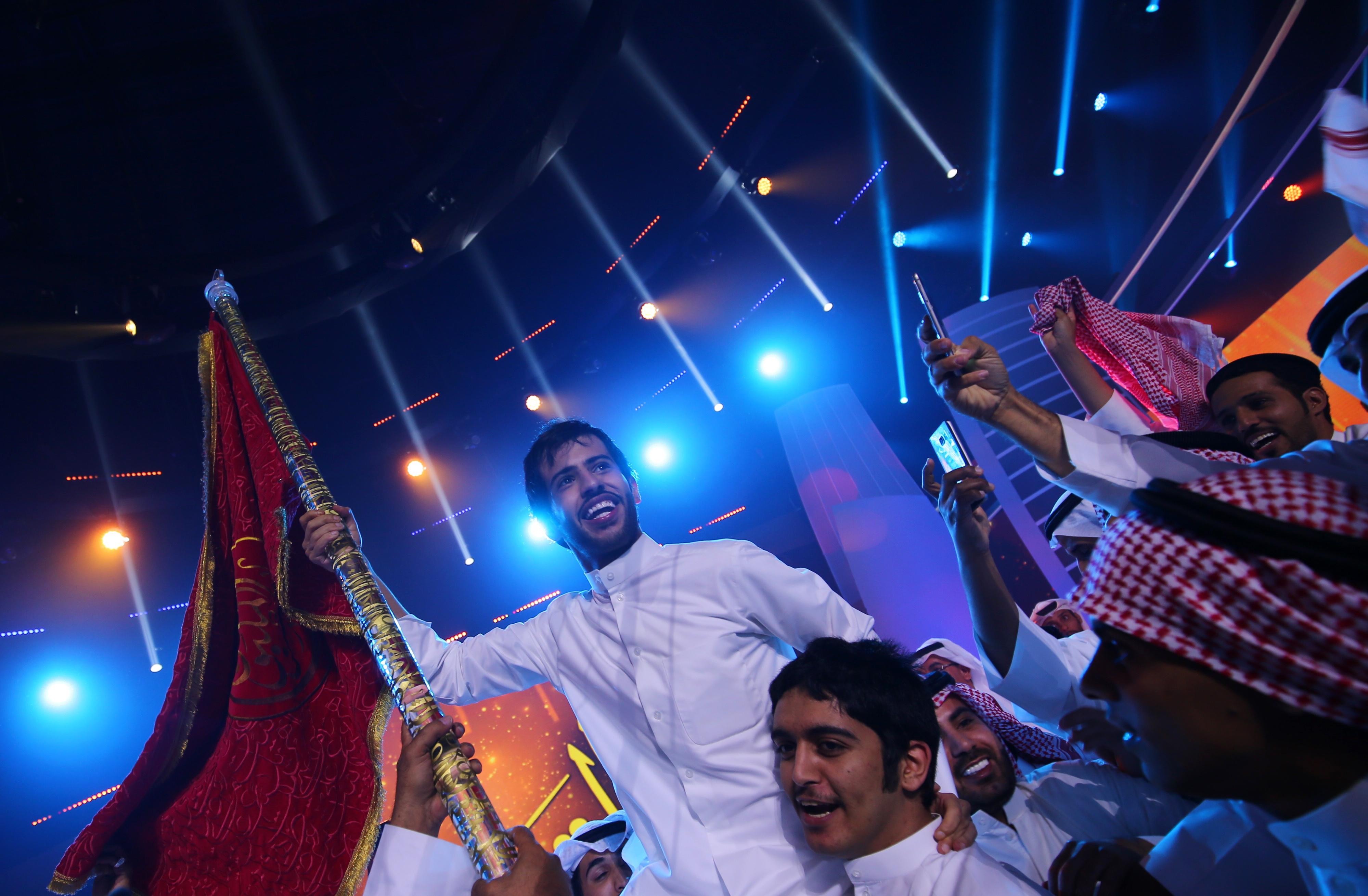 Kuwaiti student Rajih al-Hamidani wins the final of Million's Poet in Abu Dhabi in May 2016, including a top prize of $1.3m (AFP)