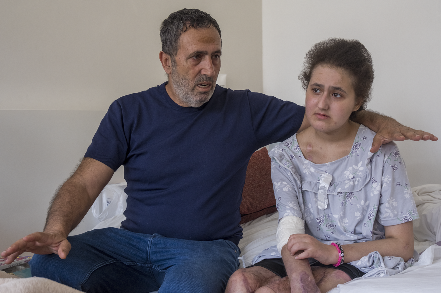 Malak al-Jabal and her father Hassan in their hotel room in Beirut, Lebanon, on 13 July 2026 (Gergana Krasteva/MEE)