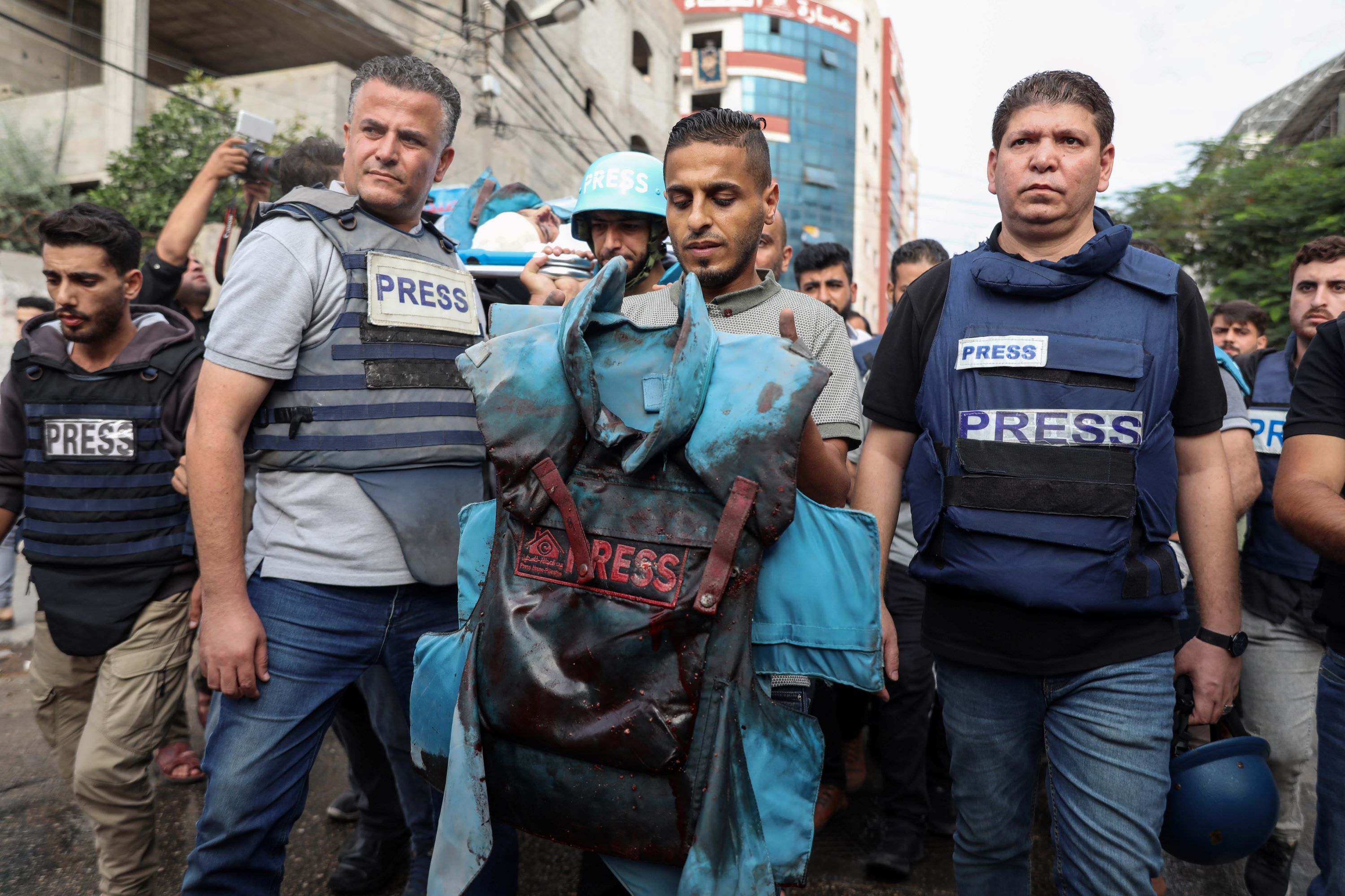 Colleagues of slain journalists at their funeral in Gaza (MEE/Mohammed al-Hajjar)