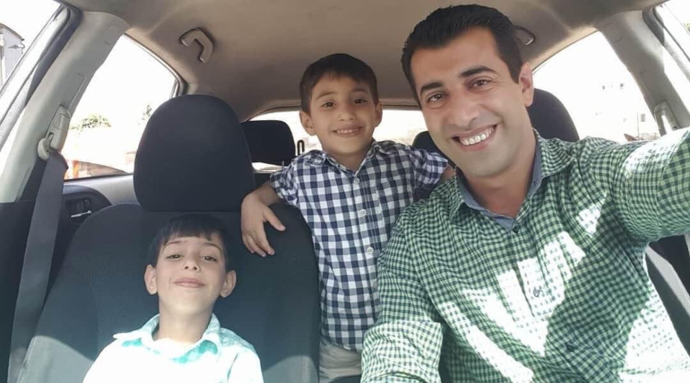 Nawajaa shared a photo of himself and his children the day before he was detained (Social media)