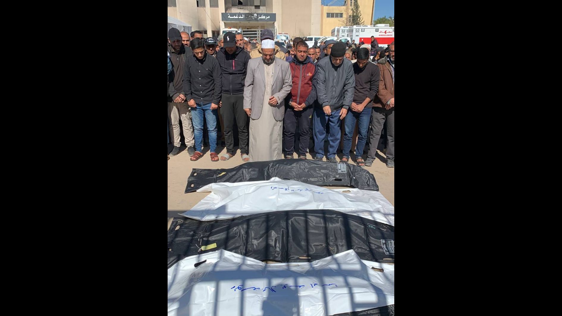 Mourners pray over those killed in Israeli strikes targeting the Nasser Hospital in Khan Younis, southern Gaza, on 24 March, 2025 (MEE/Ahmed Aziz)