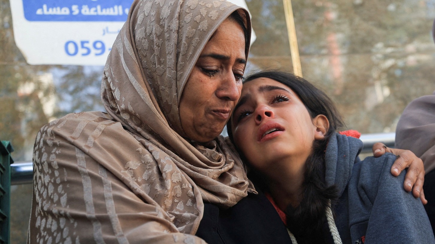 Mourners react as they attend the funeral of Palestinians who, according to medics, were killed in overnight Israeli strikes, at Al-Shifa Hospital in Gaza City, November 20, 2025. 