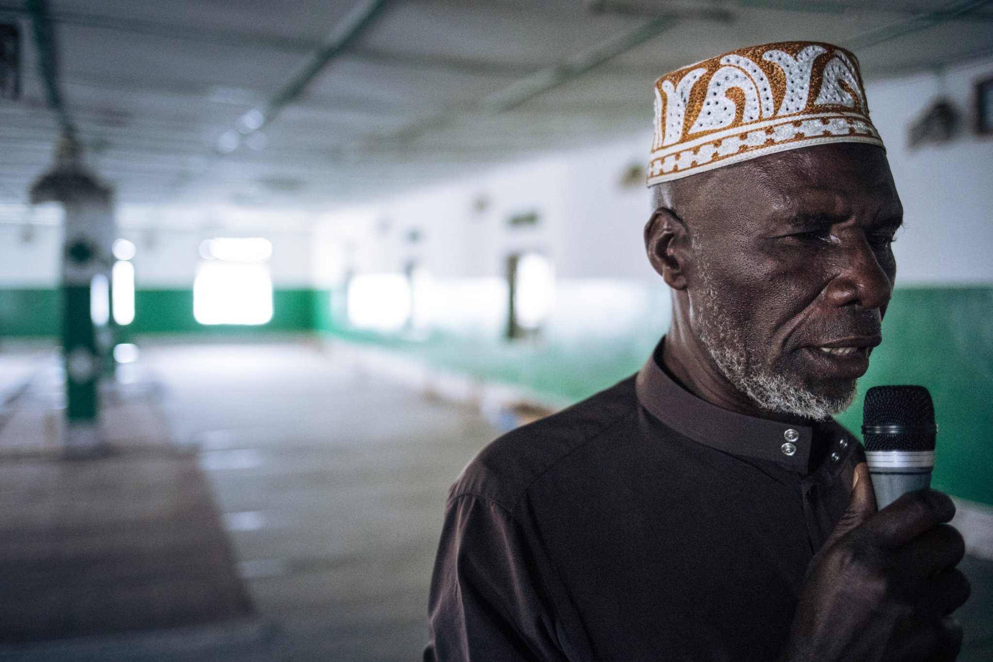 The muezzin of the Katindo mosque in Goma, Ibrahim Zakaria Banza, calls for prayer in the mosque deserted by the Muslims, on March 22, 2020, in the northeast of the Democratic Republic of Congo. On March 18, 2020, the President of the Democratic Republic of Congo, Felix Tshisekedi, asked the places of worship to close for four weeks as part of the fight against the spread of the COVID-19 coronavirus.