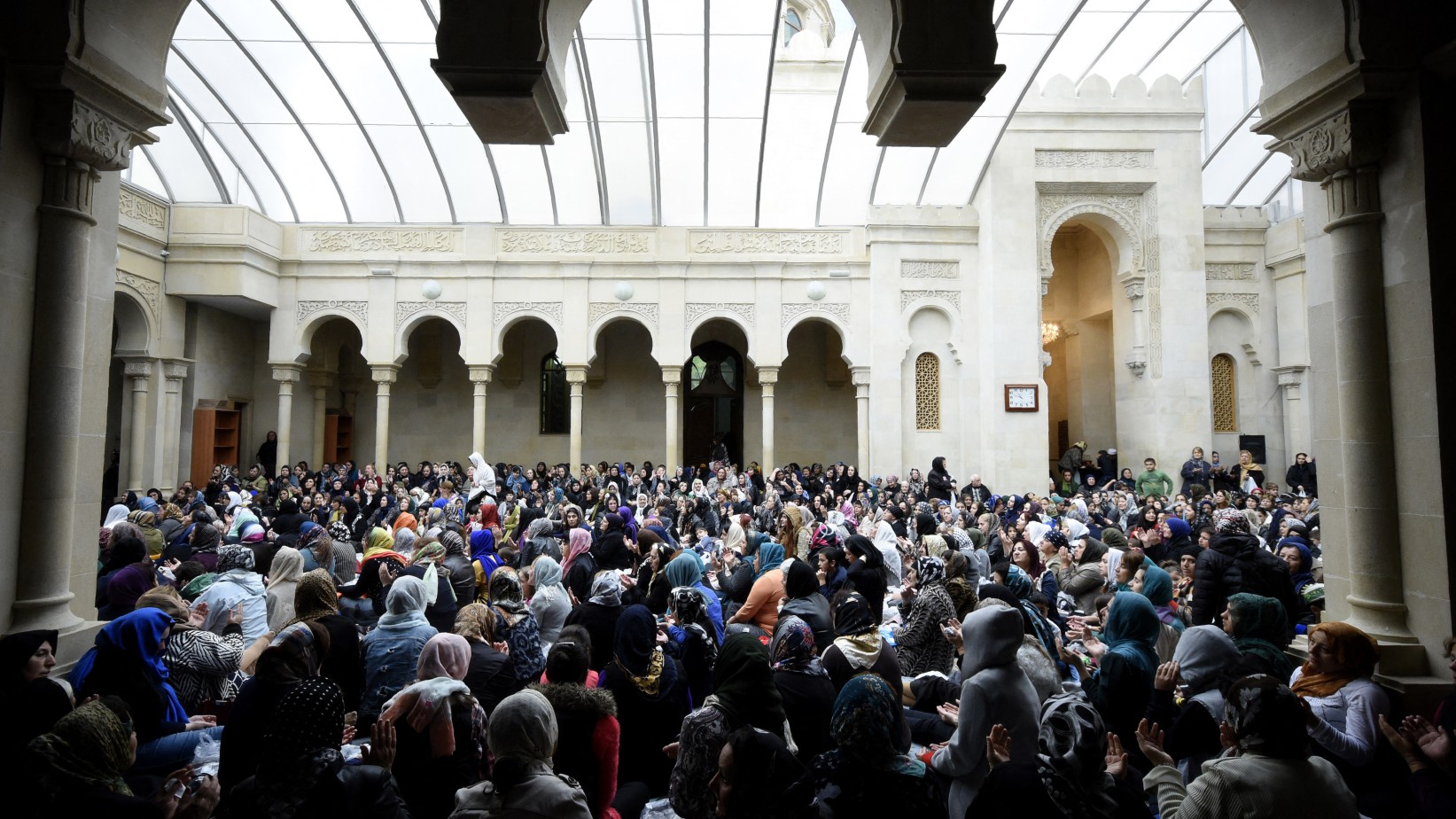 Muslim women gather to pray in the Azhdarbek Mosque, also known as the Blue Mosque, in central Baku on October 1, 2017