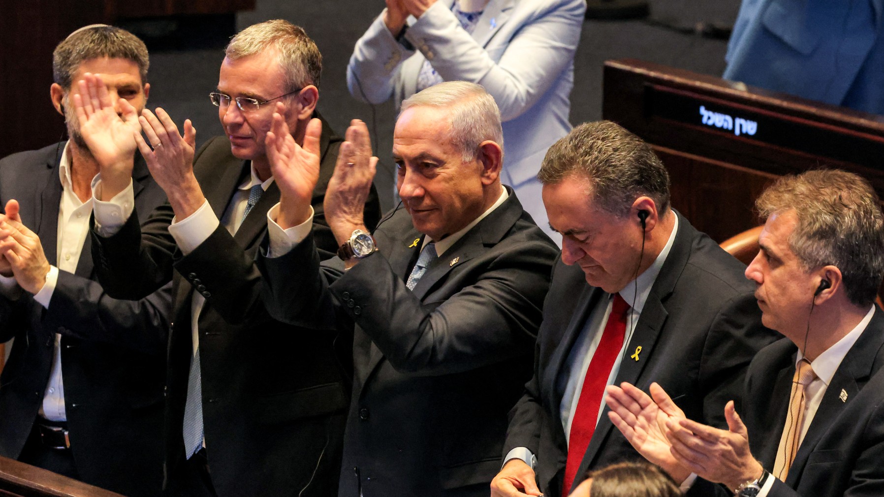 Israeli Prime Minister Benjamin Netanyahu and Likud members applaud during the address of Argentina's President in the Knesset in June 2025 (AFP)