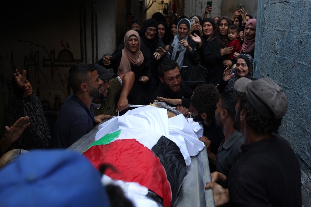 Palestinians mourn a relative, killed the night before in an Israeli strike, during their funeral in Gaza City on July 29, 2025. Omar AL-QATTAA / AFP