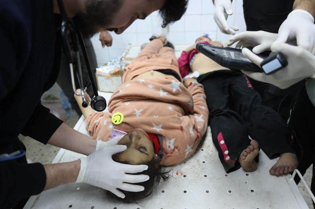 A doctor checks the vitals of a Palestinian child at Al-Ahli Arab hospital, also known as the Baptist hospital, in Gaza City on 8 January 2025, during Israel’s war on the Palestinian enclave (Omar Al-Qattaa/AFP)