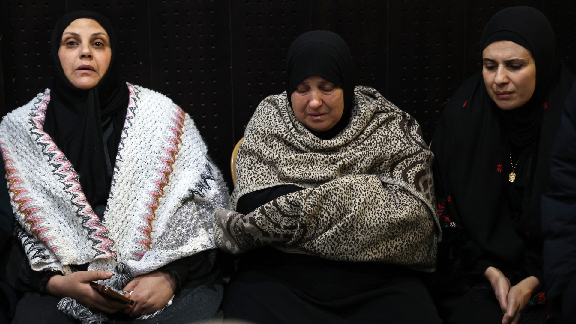 Palestinian families react after Israel delayed the release of Palestinian prisoners, scheduled to be released in the seventh hostage-prisoner exchange, in the occupied West Bank city of Ramallah early on February 23, 2025