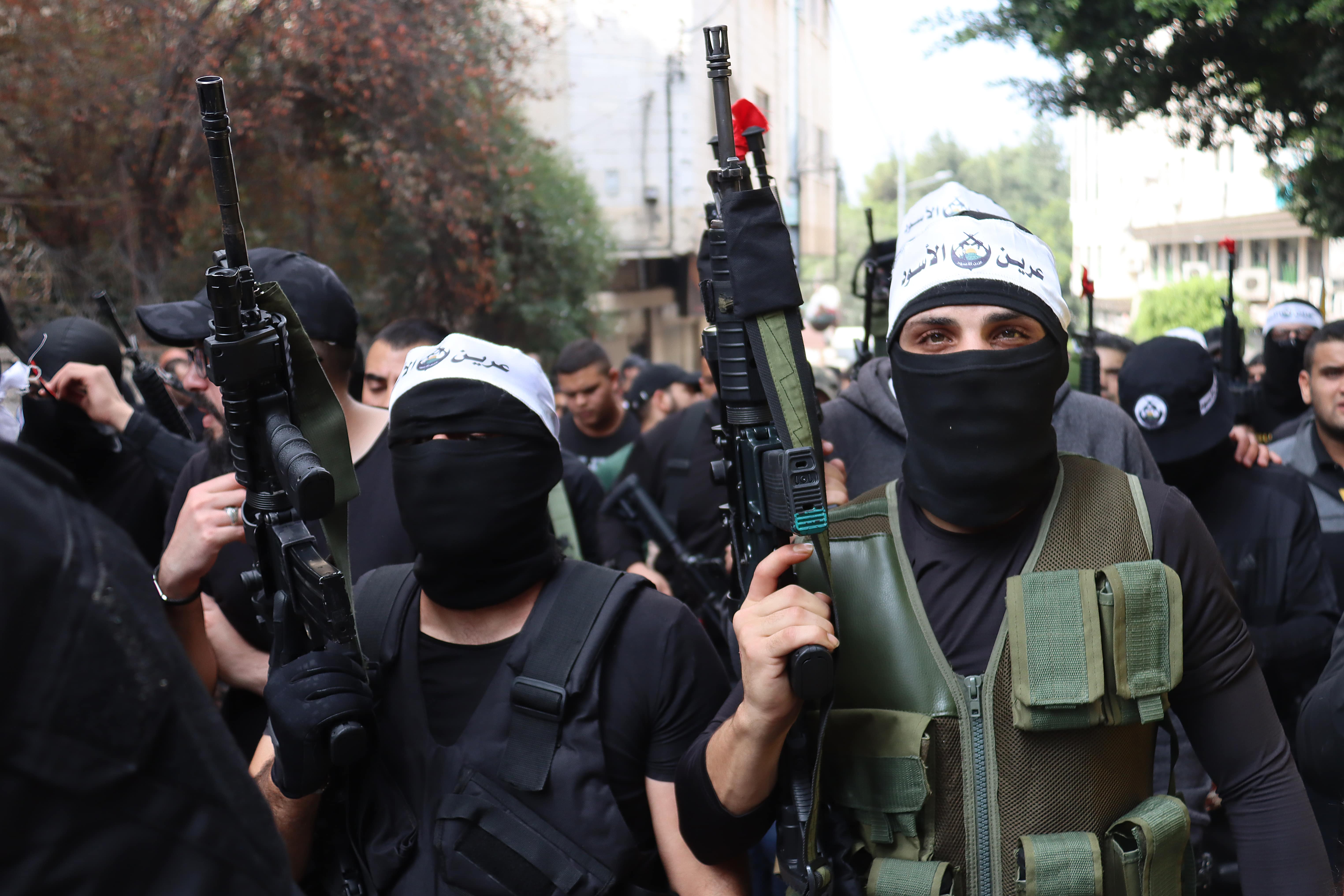 Palestinian fighters from the Lions’ Den group rally in Nablus in the occupied West Bank on 23 October 2022 (MEE/Ahmad Al-Bazz)  