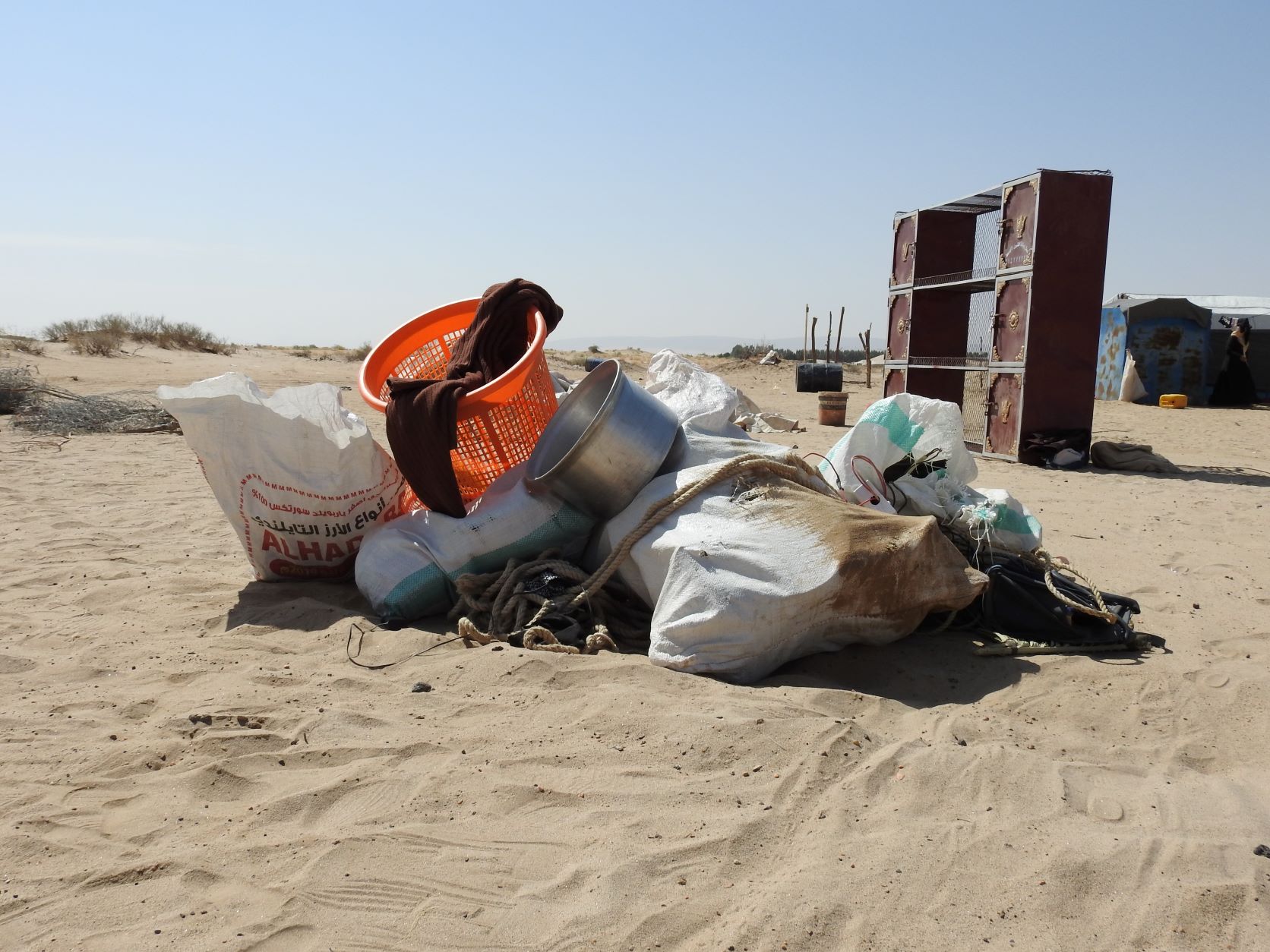 Pile of household utensils at Al-Nogia'a camp for internally displaced people (IDPs) in Marib, Yemen November 10, 2021 (MEE/Hashem Khaled)