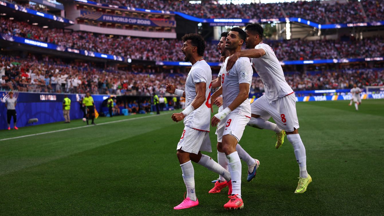 Ramin Rezaeian celebrates Iran’s second goal with teammates during the Fifa World Cup 2026 in Inglewood, California, 15 June 2026 (Dean Mouhtaropoulos/Getty Images via AFP)