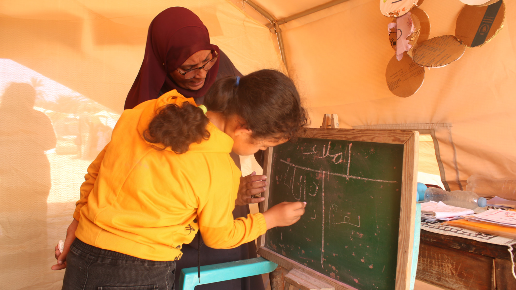 Saja Abed Rabbo (C) was overjoyed to return to classes, according to her family (MEE/Abdallah al-Naami)
