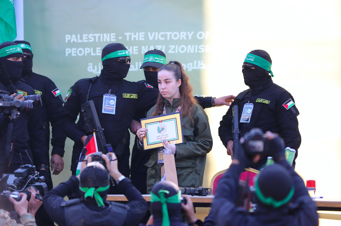 Released Israeli captive Agam Berger on a stage before Hamas handed her over to a Red Cross team in Jabalia on January 30, 2025. (Mohamed al-Hajjar)