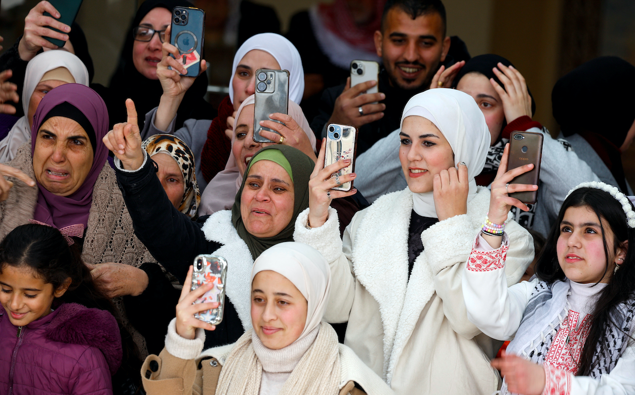 People celebrate after Palestinian prisoners were released by Israelas part of a ceasefire deal in Gaza. (Reuters/Mohammed Torokman)