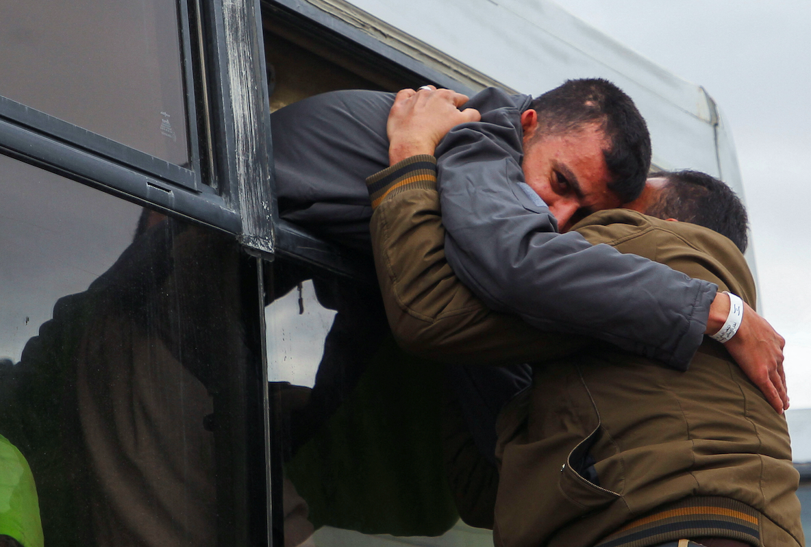 A Palestinian prisoner in Khan Younis in the southern&nbsp;Gaza&nbsp;Strip hug a loved one after being released from an Israeli jail. (Reuters/Hatem Khaled)