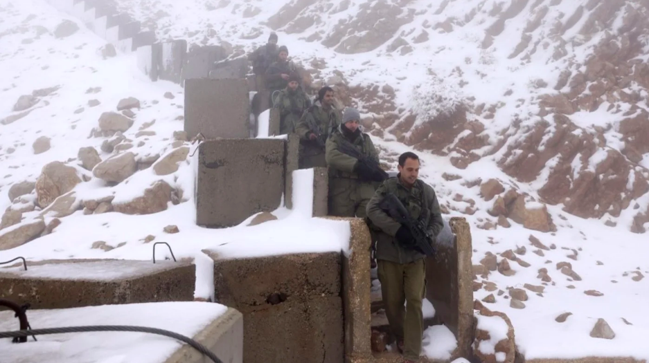 Israeli soldiers patrol the top of Mount Hermon near the border with Lebanon in the Israel-annexed Golan Heights on 20 November 2023 (Jalaa Marey/AFP)
