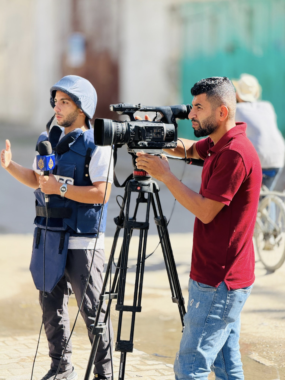 A photograph shared by Aljazeera Arabic Gaza correspondent Anas al-Sharif on X shows him at work alongside one of his colleagues, al-Quds al-Youm cameraman Adam Abu Harbeid, who was killed in an Israeli air strike on 24 July 2025.