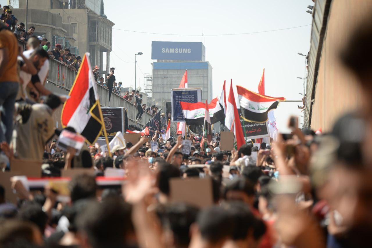 Students march in Al Tayaran Tunnel to celebrate the first anniversary of October.