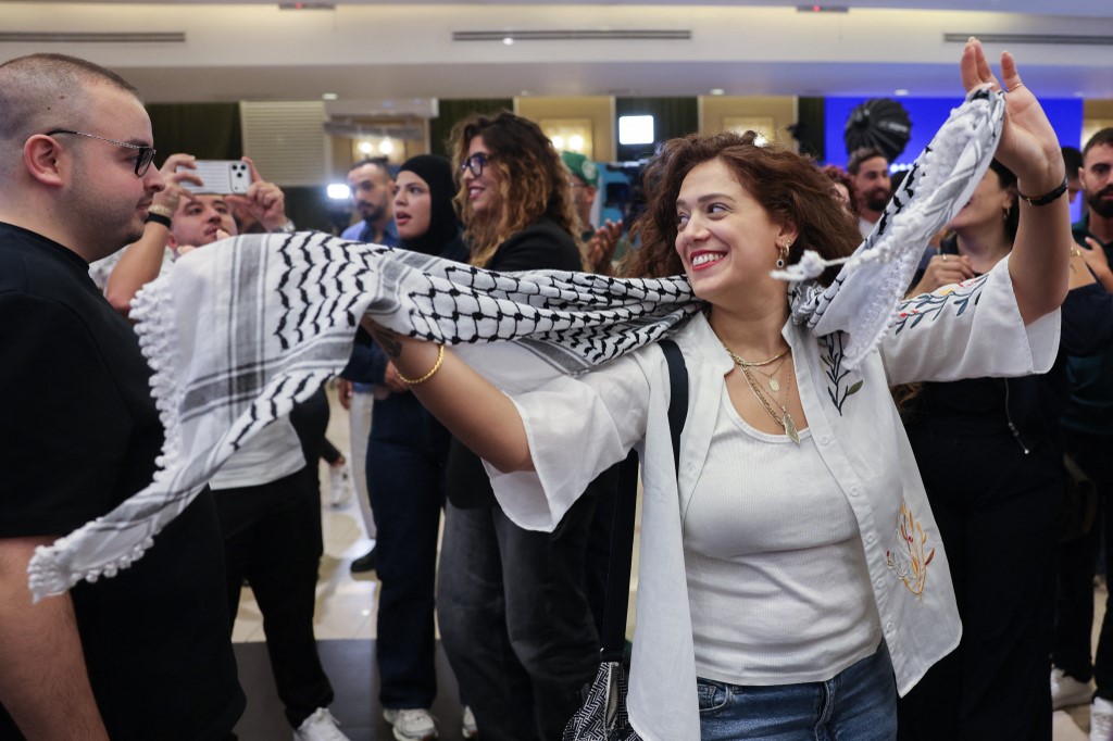 Supporters of Israel's Palestinian-led Joint List political alliance cheer at the alliance's campaign headquarters in the northern Israeli city of Nazareth on October 27, 2026,