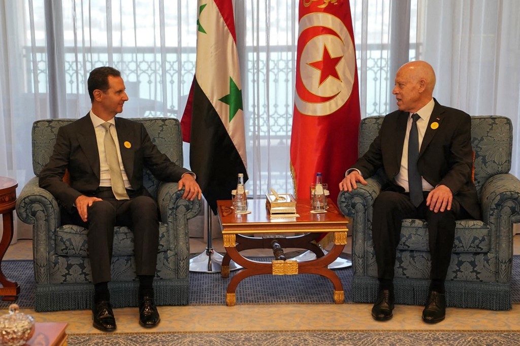 Syrian President Bashar al-Assad (L) meets with his Tunisian counterpart Kais Saied (R) on the sidelines of the Arab League Summit in Jeddah on 19 May 2023 (Syrian Presidency/AFP)