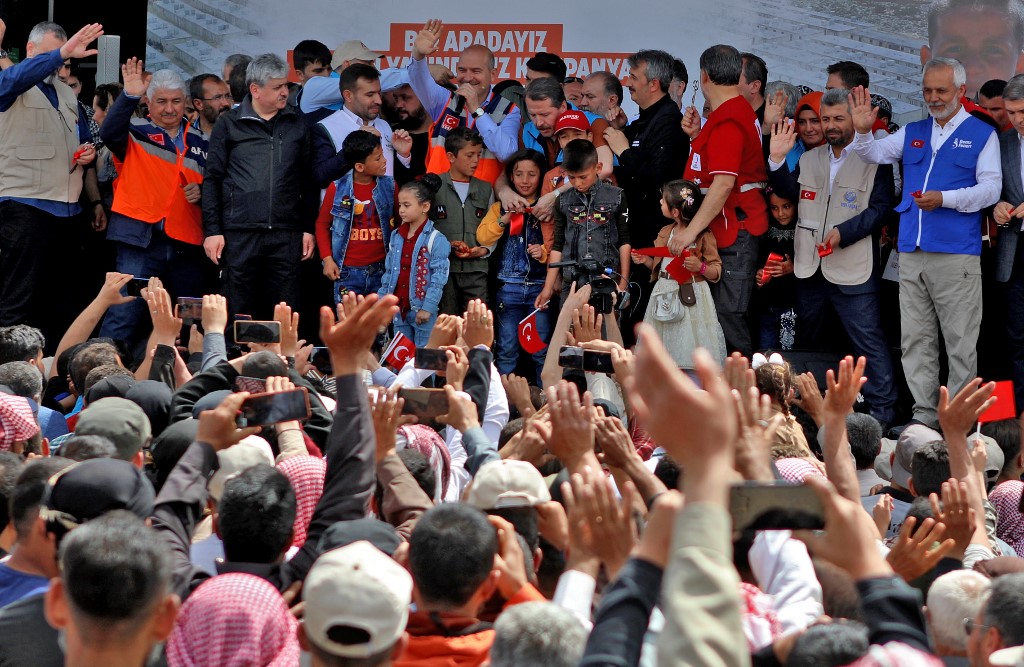 Turkish Minister of Interior Süleyman Soylu speaks during the inauguration of a housing complex for internally displaced Syrians built with Turkey's support, at the Kammouneh camps near the town of Sarmada in Syria's northwestern Idlib province, on May 3, 2022.