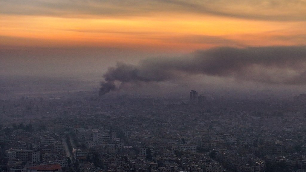 Smoke billows over Damascus after Israeli air strikes early on Tuesday (Omar Haj Kadour/AFP)