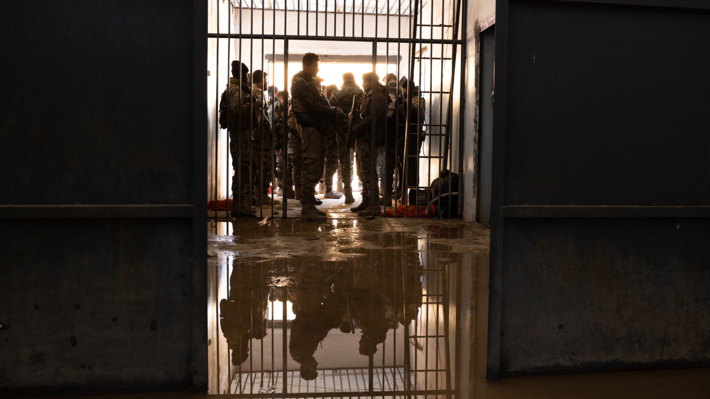 Syrian government forces stand inside the Shaddadi prison in northeastern Syria, 21 January 2026 (Hosam Katan/MEE)