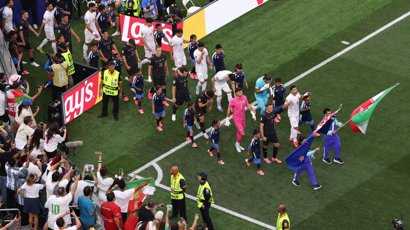 Teams are led onto the field by flag bearers before the FIFA World Cup 2026 Group G match between Iran and New Zealand in Los Angeles, California, 15 June 2026 (Stu Forster/Getty Images via AFP)
