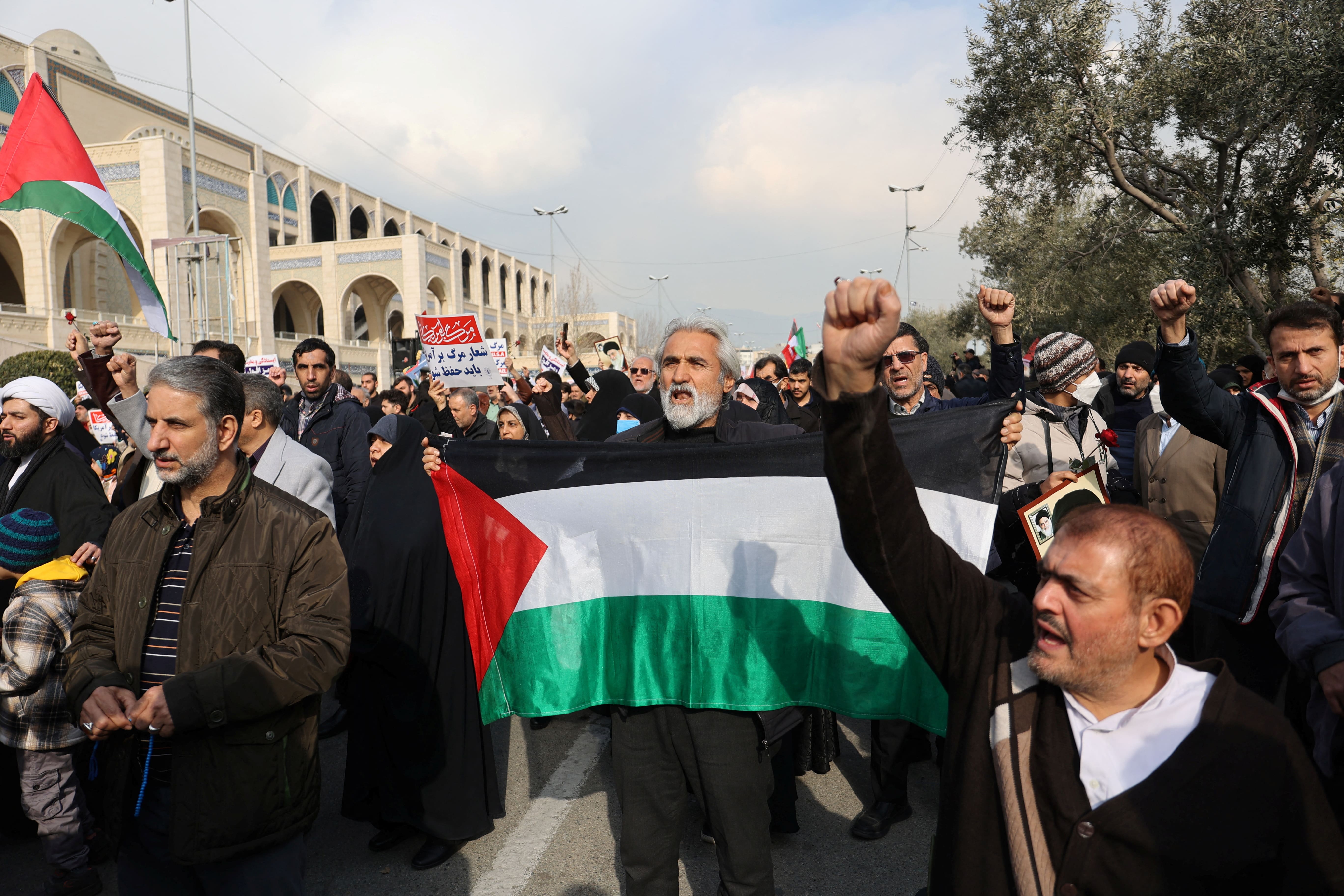 Iranians attend a rally in solidarity with Palestinians in Gaza after news of a ceasefire between Hamas and Israel, in Tehran, Iran (Reuters/WANA/Majid Asgaripour)