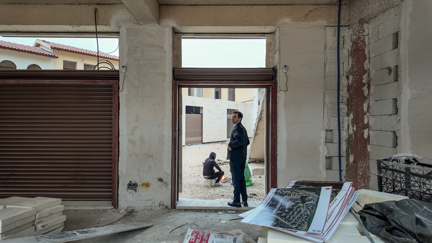 Furkan Demirci, the chairman of Turkey Design Council, is inside a store being rebuilt in Antakya's old city in Hatay, Turkey on 5 February 2025. (MEE / Fikret Can Kusadali)