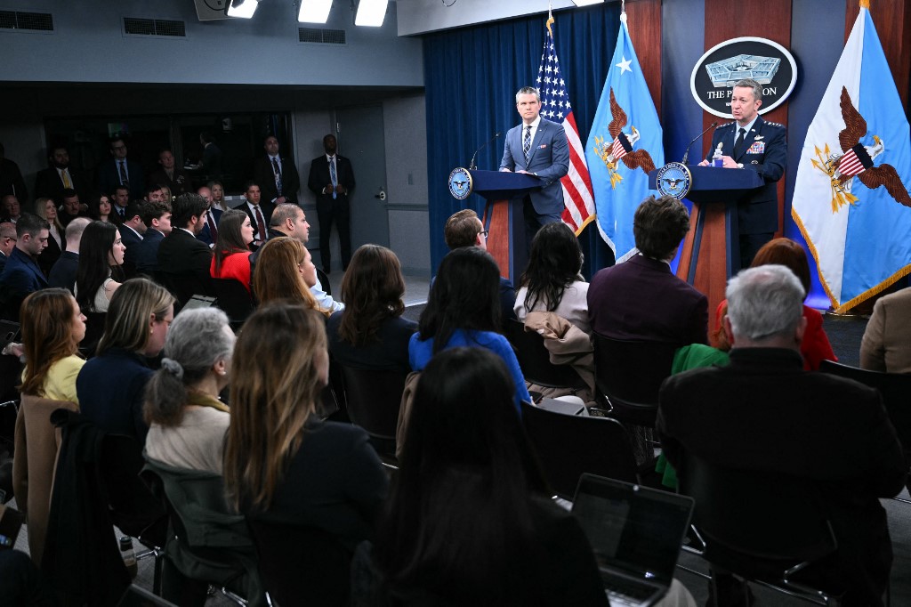 US Secretary of Defense Pete Hegseth and Chairman of the Joint Chiefs of Staff General Dan Caine speak during a news conference at the Pentagon in Washington, DC, on 19 March 2026. (AFP)