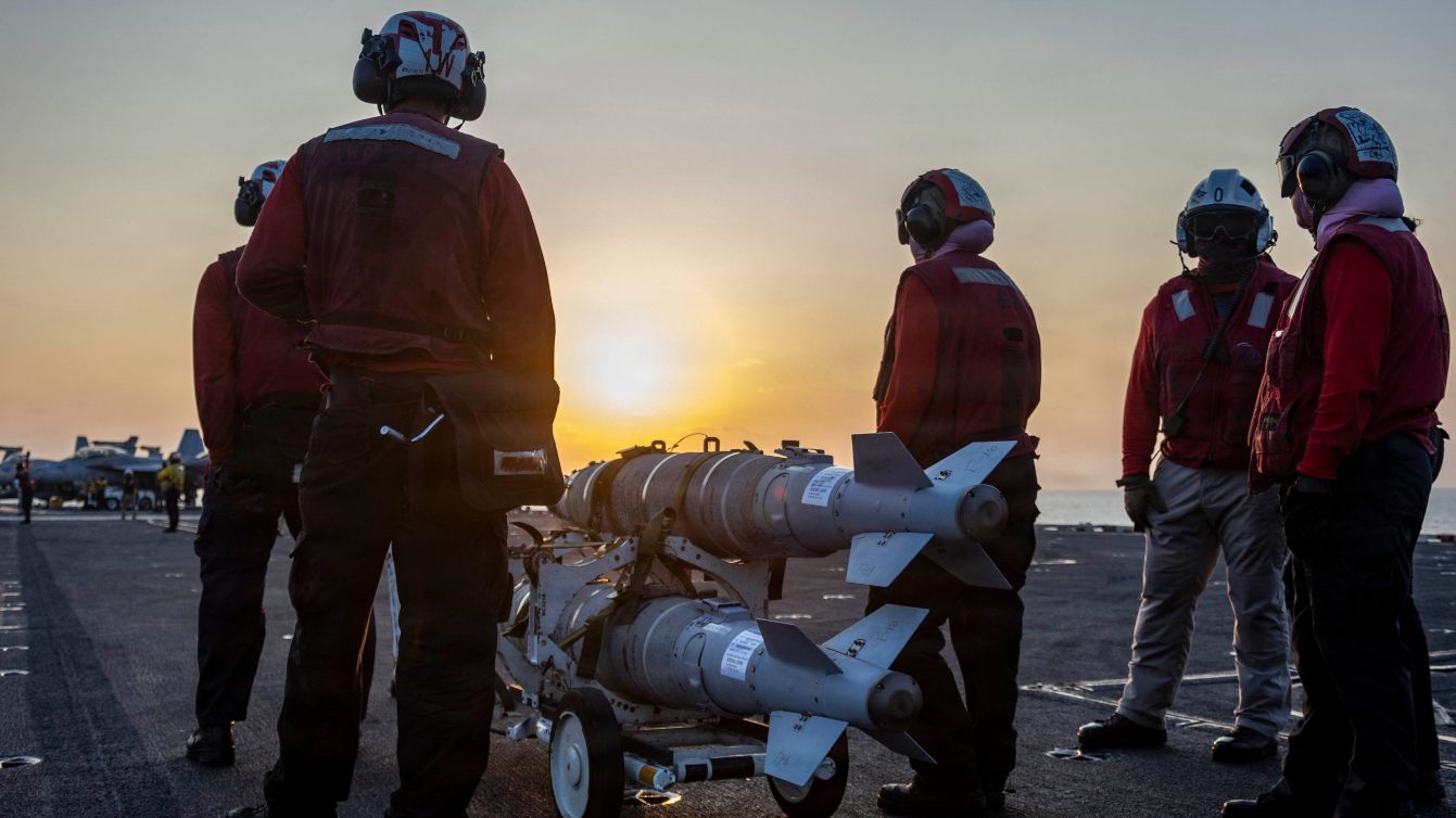 US sailors prepare ordnance on the flight deck of USS Abraham Lincoln during Operation Epic Fury, 4 March 2026 (US Navy/AFP)