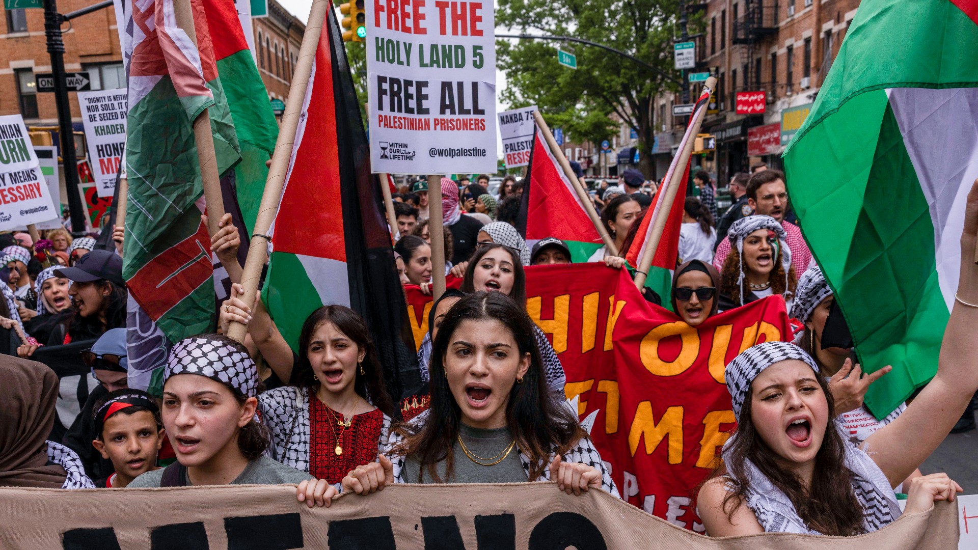 Palestine rights supporters march to mark the 75th anniversary of Nakba, or the 