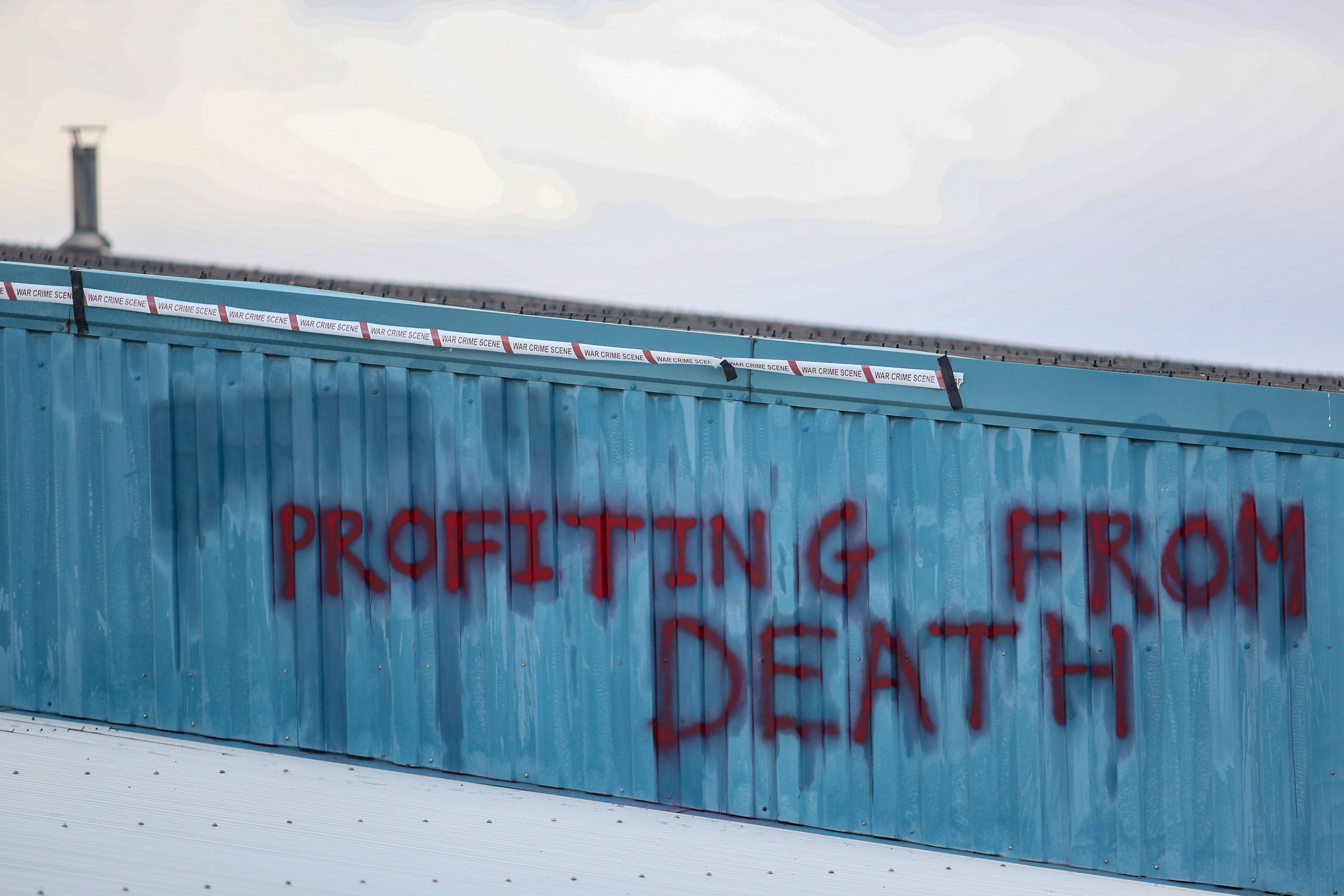 The front of the factory was spray-painted with the words 