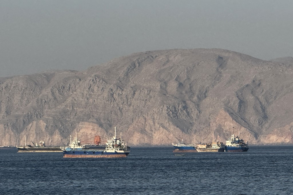 Vessels are seen anchored in the Strait of Hormuz, off the port city of Khasab on Oman’s northern Musandam Peninsula on 17 May 2026 (Reuters)
