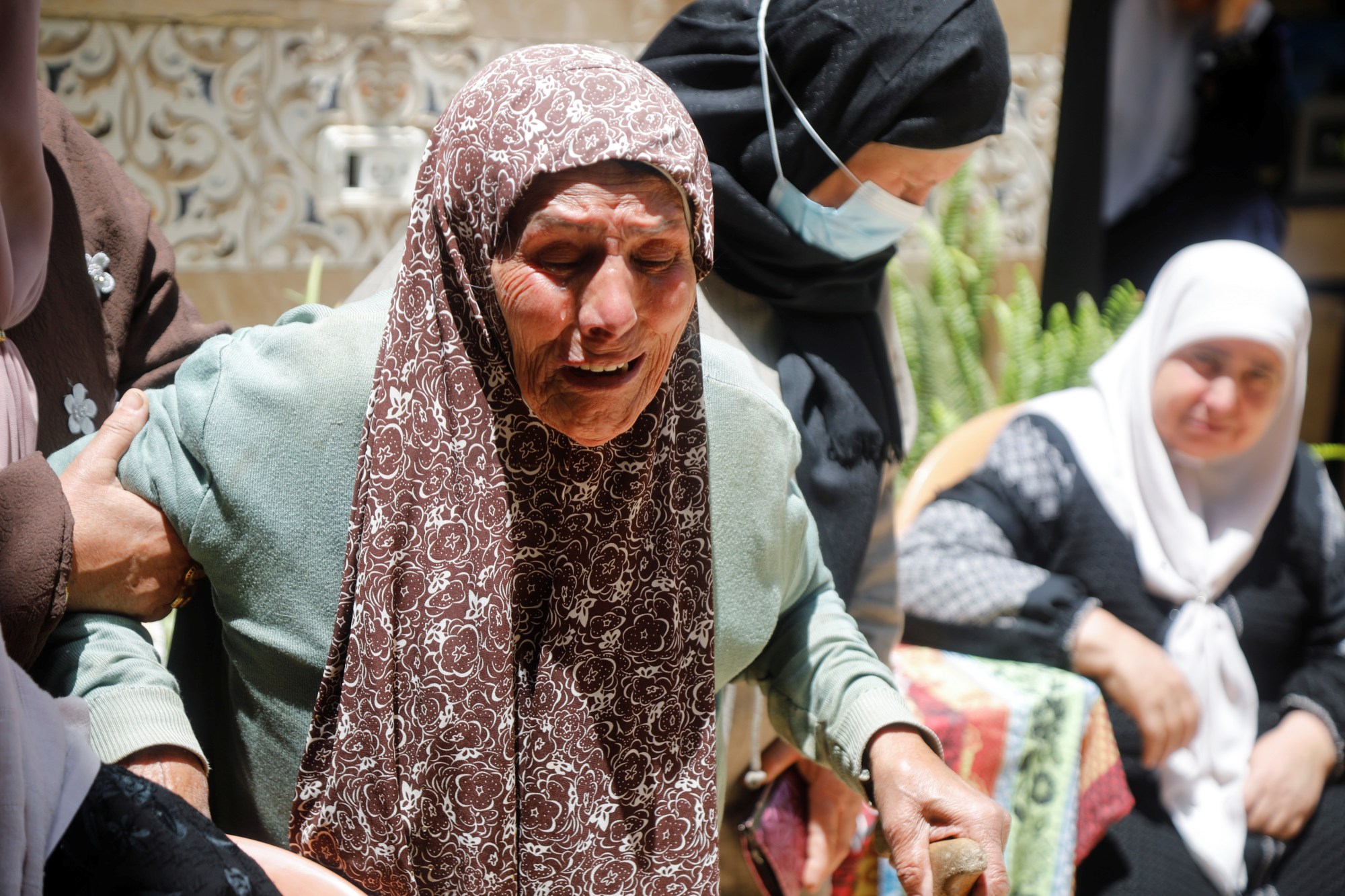 A woman mourns the death of 16-year-old Rashid Abu Arreh, who was killed by Israeli forces near Tubas in the Israeli-occupied West Bank on 12 May 2021 (Reuters)