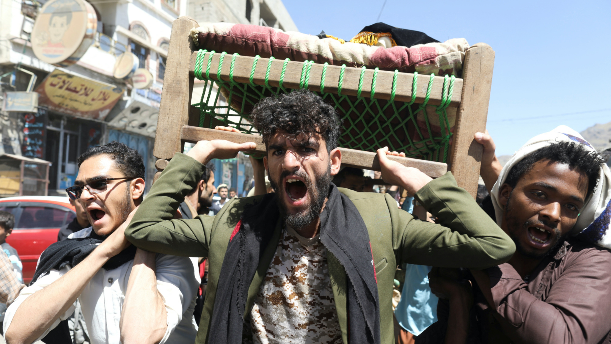 Mourners react during the funeral of Hashim Suwaid, 14, who was among the 10 children with leukemia who died from contaminated chemotherapy medicine in Sanaa, 17 October 2022 (Reuters)