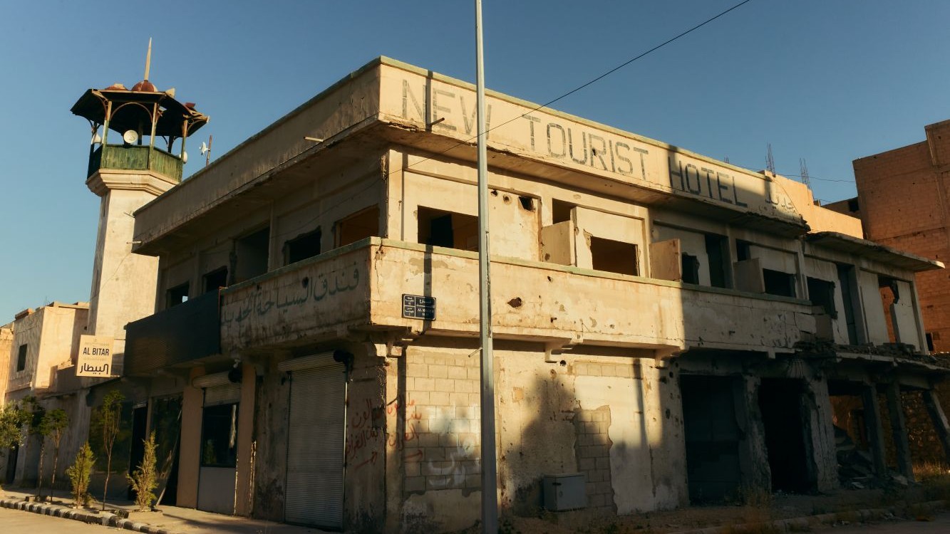 A road in the modern city of Palmyra that was once lined with hotels and guesthouses now bears the scars of war.