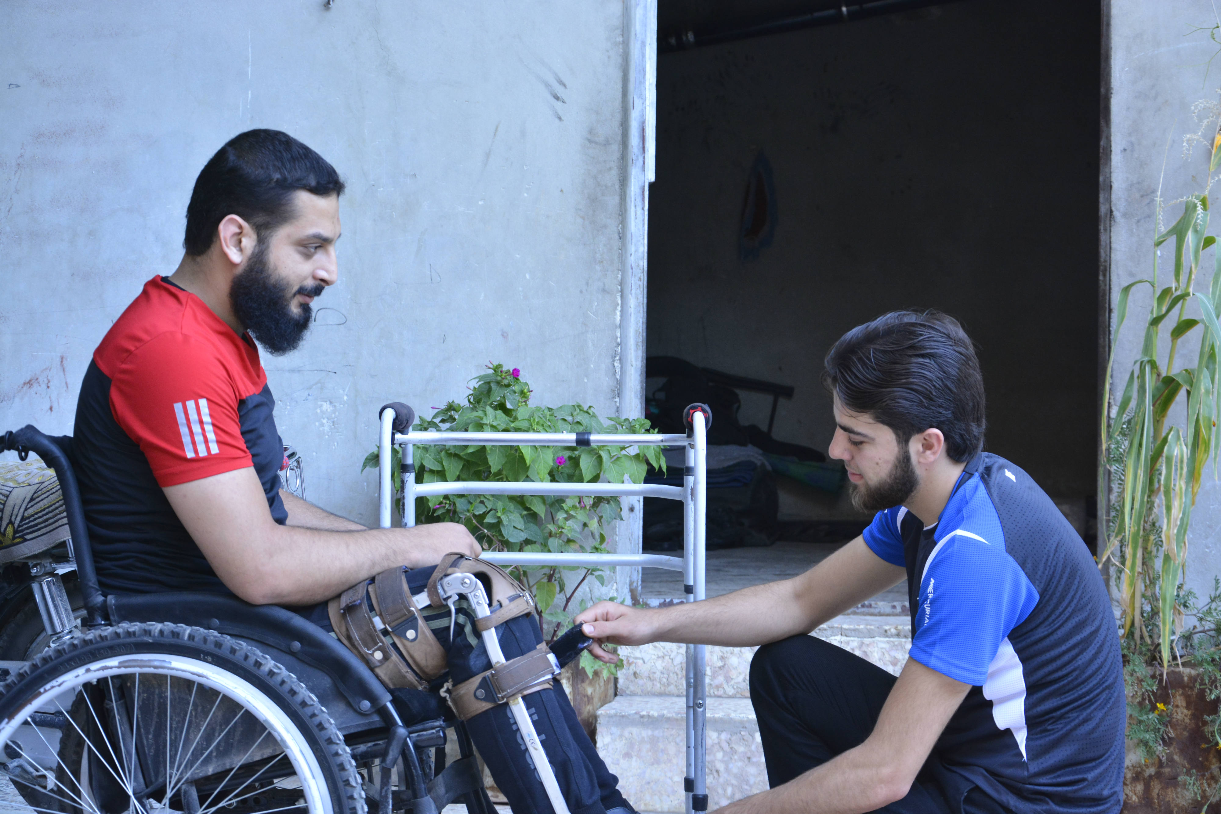 Dabbas tends to a wounded rebel fighter, in nothern Syria's Dana (MEE/Harun al-Aswad)